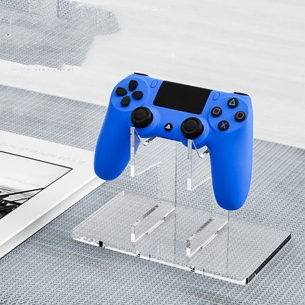 Two-tier acrylic game controller stand supporting PS5, Xbox, and Switch