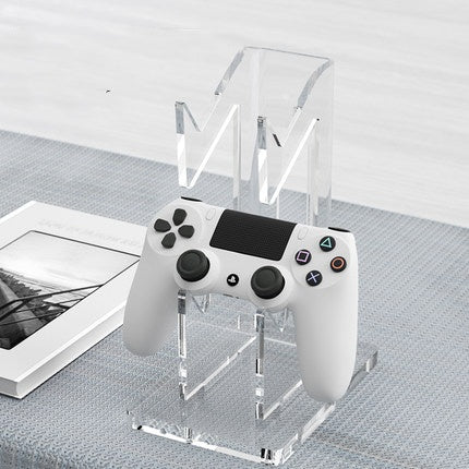Two-tier acrylic game controller stand supporting PS5, Xbox, and Switch