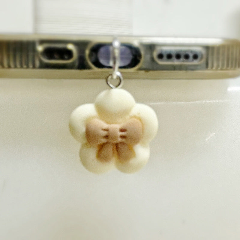 The dust protection cap with a bear for mobile phones and charging port