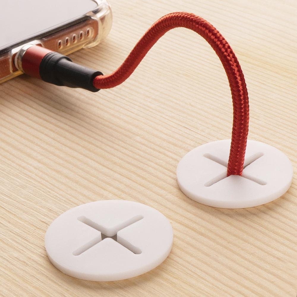 Cross-shaped opening for multi-directional cable passthrough