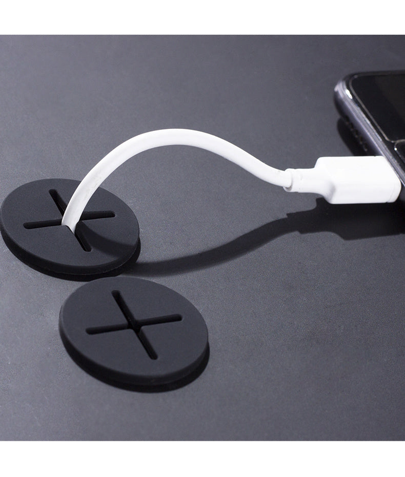 Cable organizer plug keeps desk tidy and blocks dust