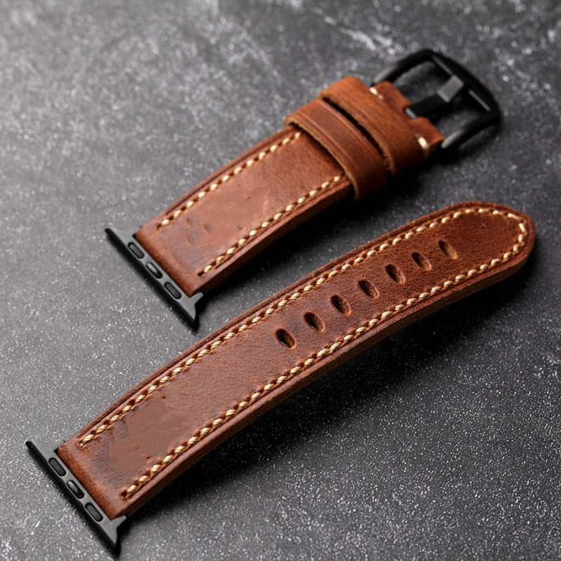 Hand-stitched leather strap with fine steel buckle and thick profile