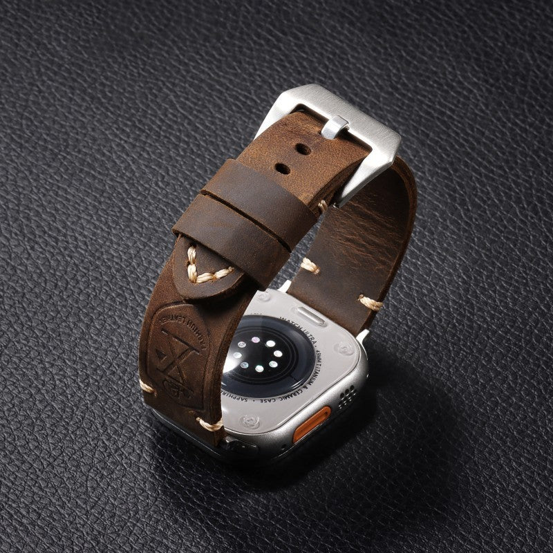 Leather watch strap with subtle floral detailing for contrast