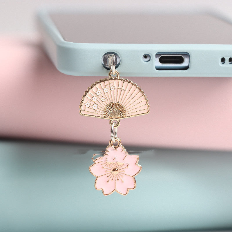 Pink Type-C dust stopper accessory for iPhone