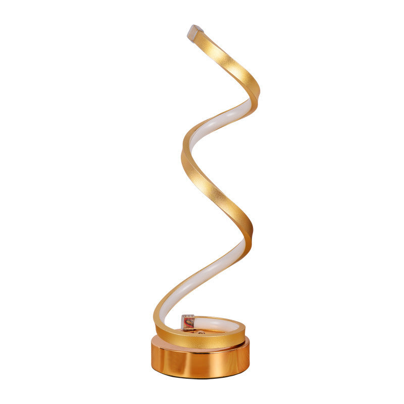 Spiral desk lamp with clamp-style space-saving design