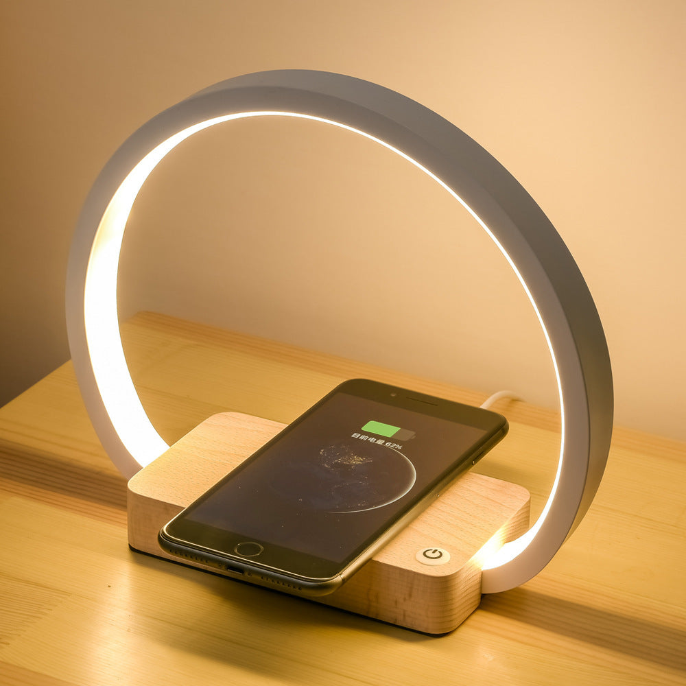 Touch control LED wireless charging desk lamp with oak base.