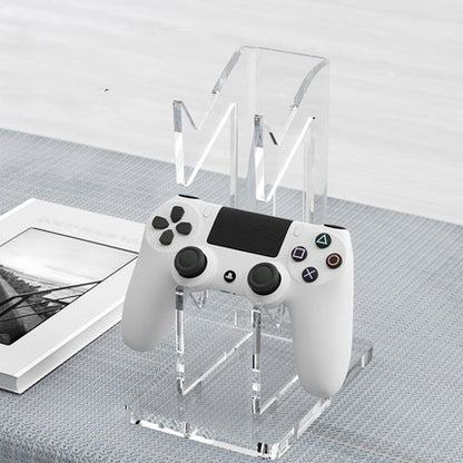 Two-tier acrylic game controller stand supporting PS5, Xbox, and Switch