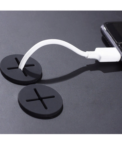 Cable organizer plug keeps desk tidy and blocks dust