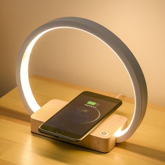 Touch control LED wireless charging desk lamp with oak base.